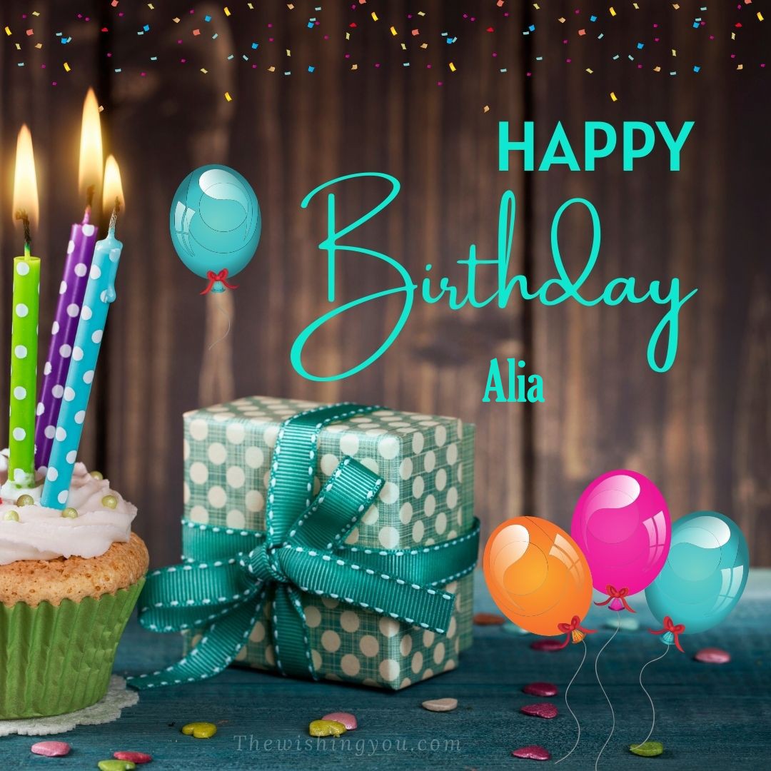 Happy birthday Alia written on image Green Cup cake and burning candlepink blue and yello balloons Gift boxes