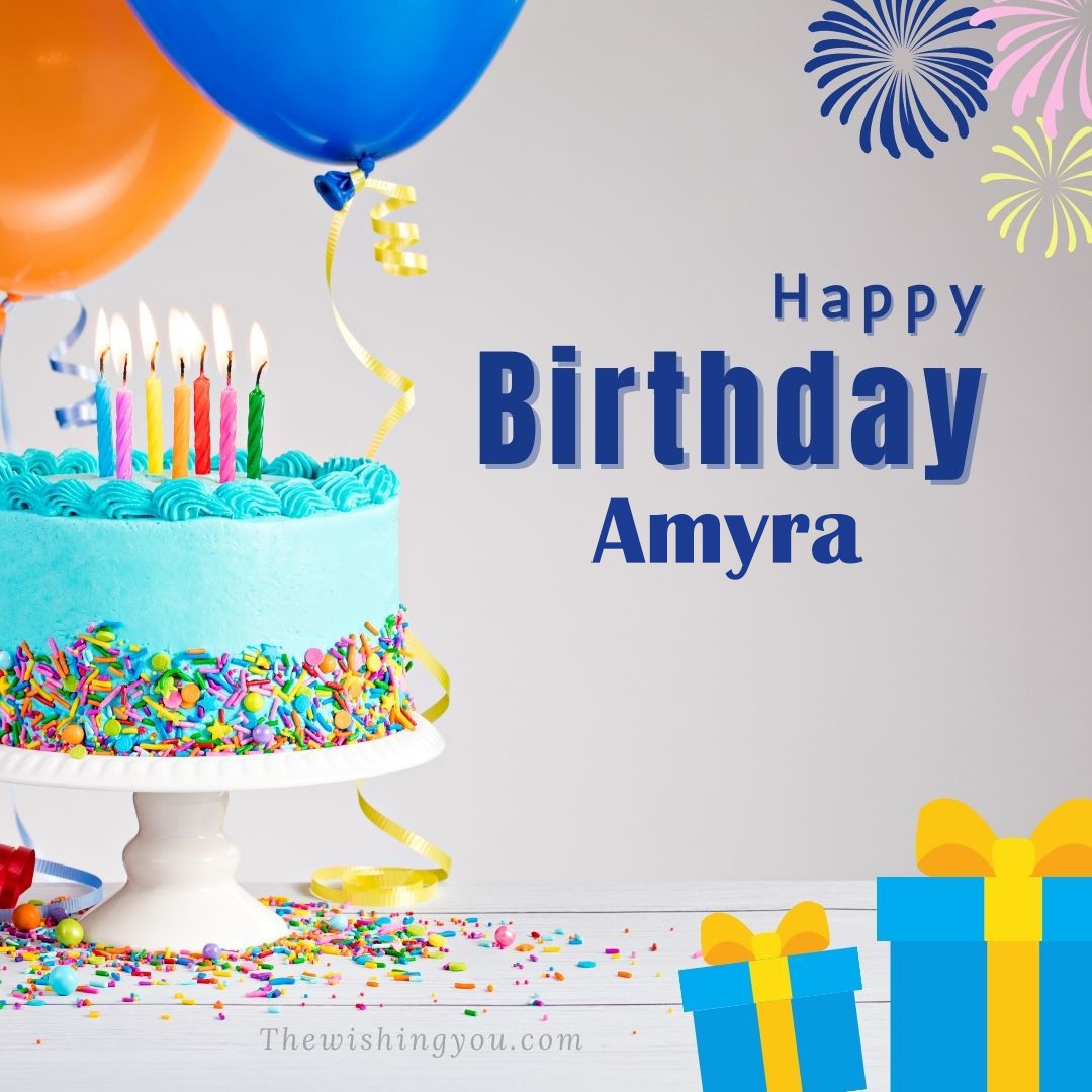 Happy birthday Amyra written on image White cake keep on White stand and blue gift boxes with Yellow ribon with Sky background