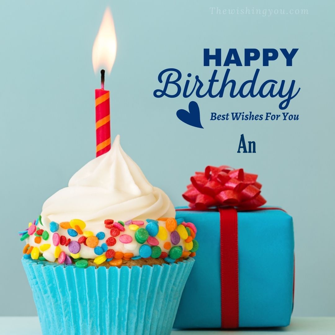Happy birthday An written on image Blue Cup cake and burning candle blue Gift boxes with red ribon