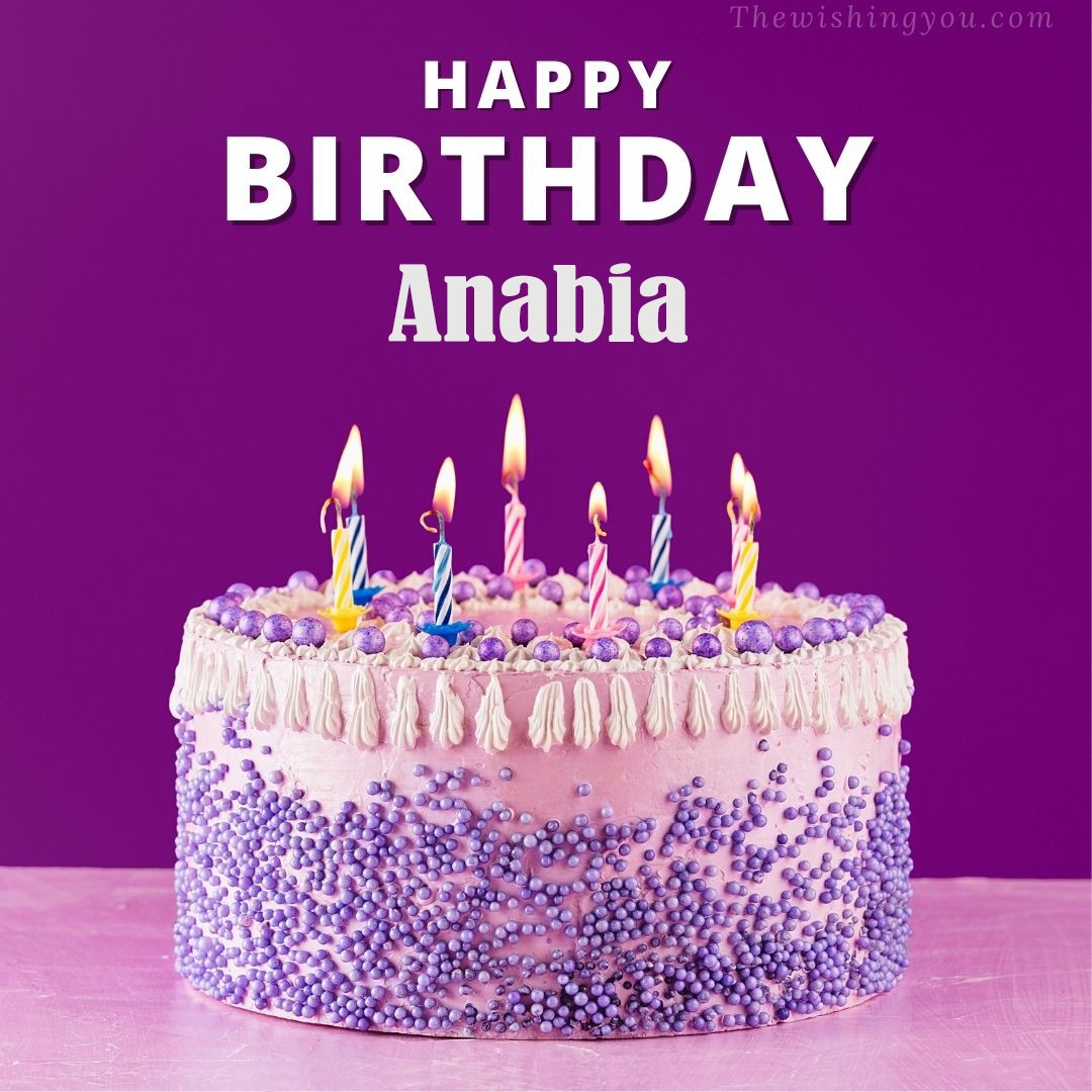 Happy birthday Anabia written on image White and blue cake and burning candles Violet background