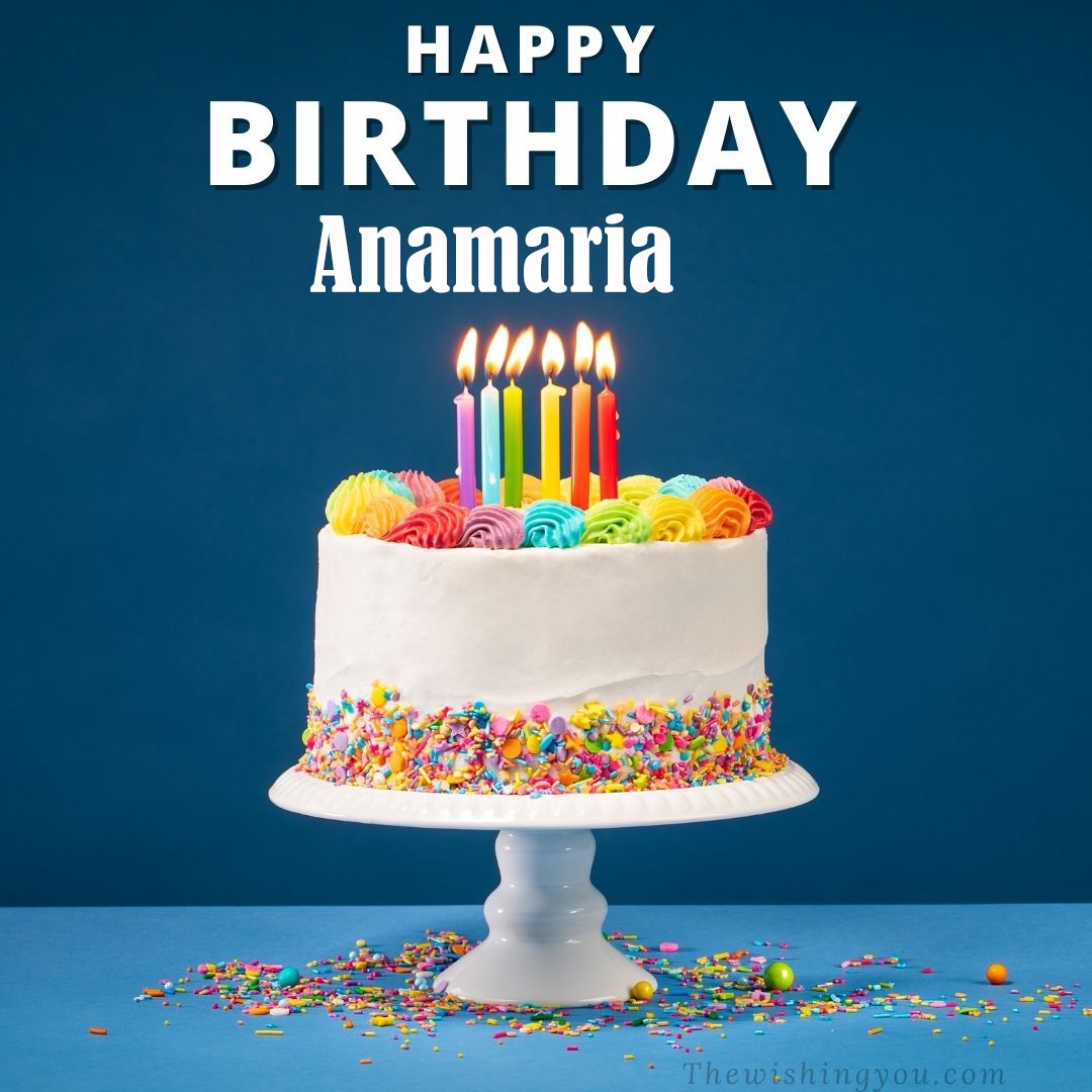 Happy birthday Anamaria written on image White cake keep on White stand and burning candles Sky background