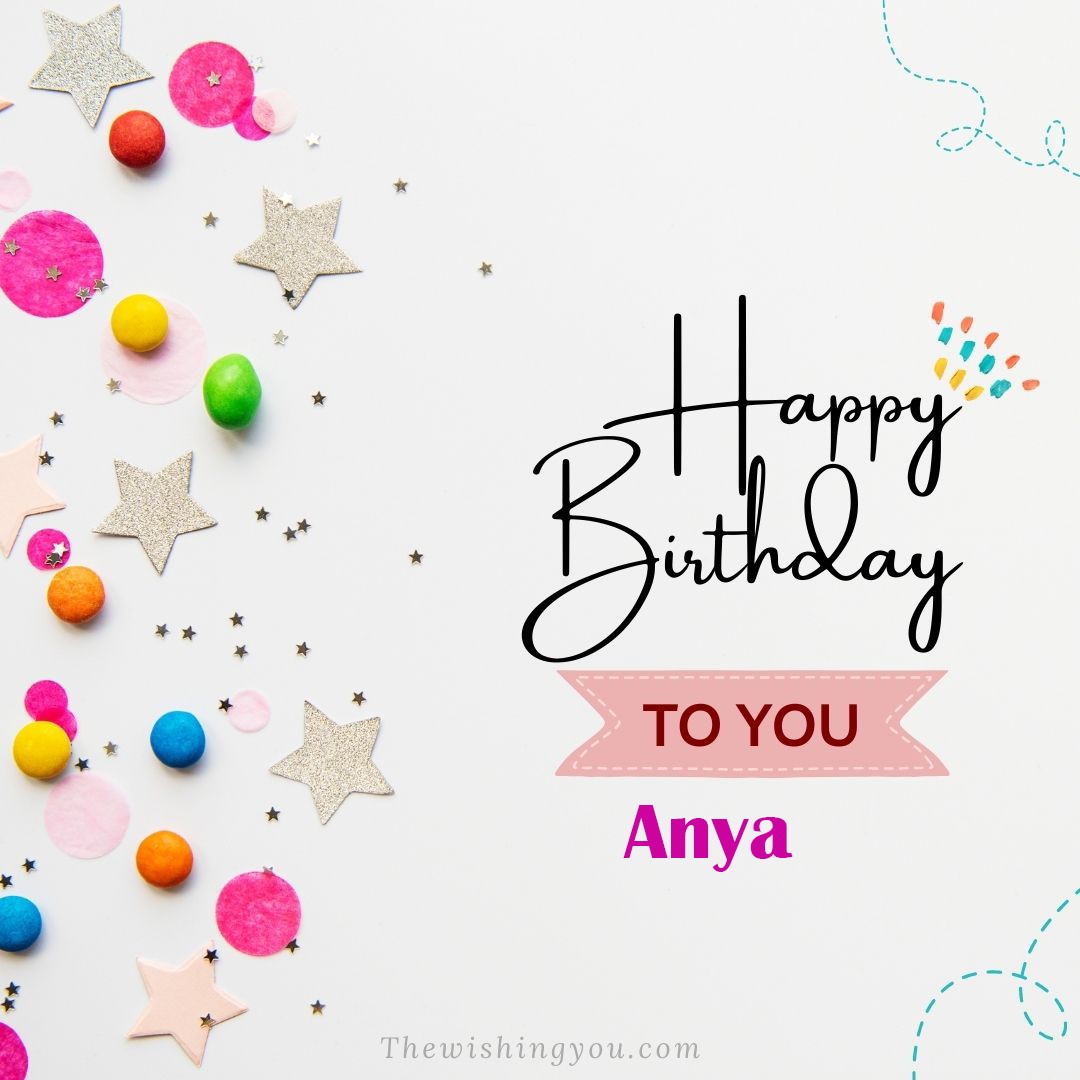 Happy birthday Anya written on image Star and ballonWhite background