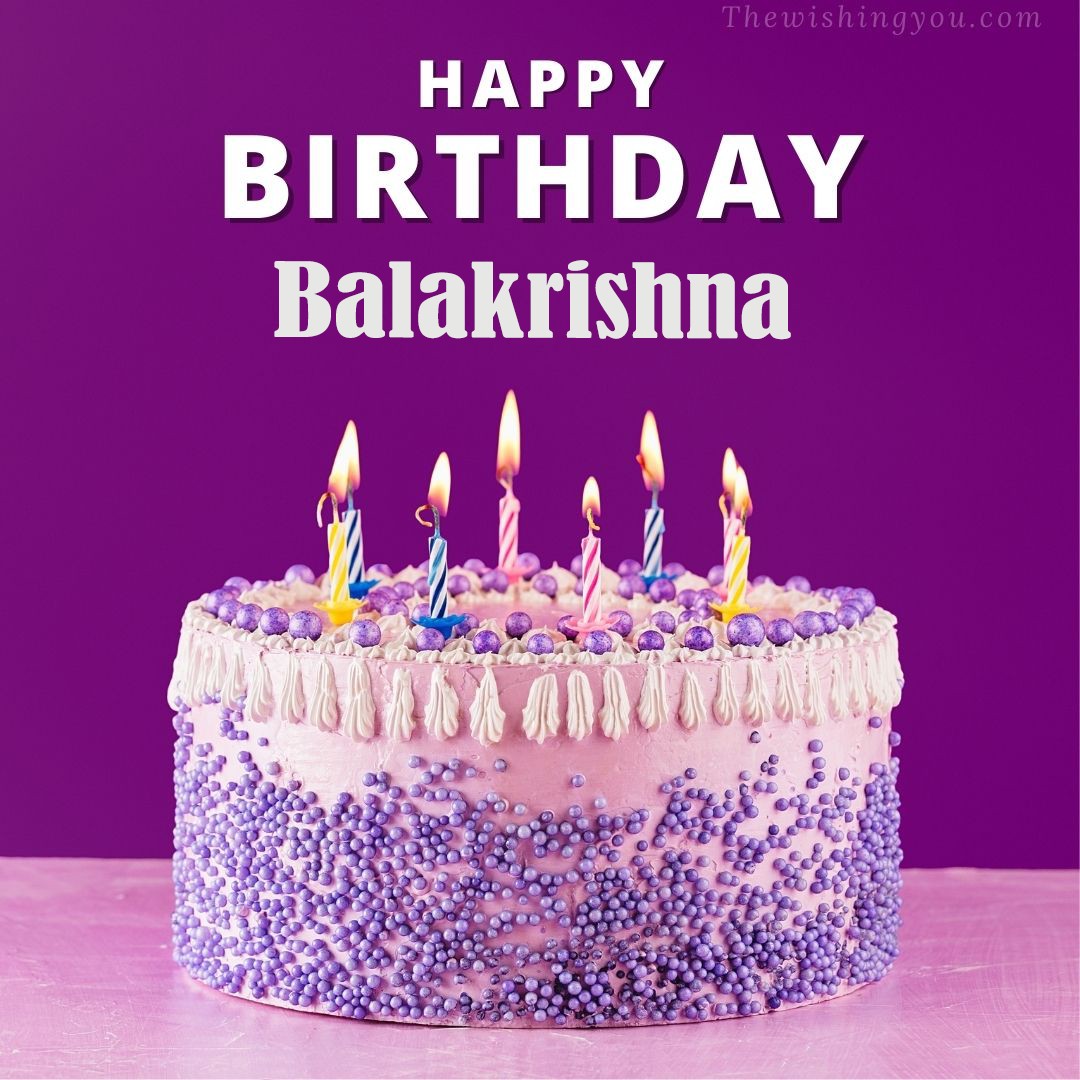 Happy birthday Balakrishna written on image White and blue cake and burning candles Violet background