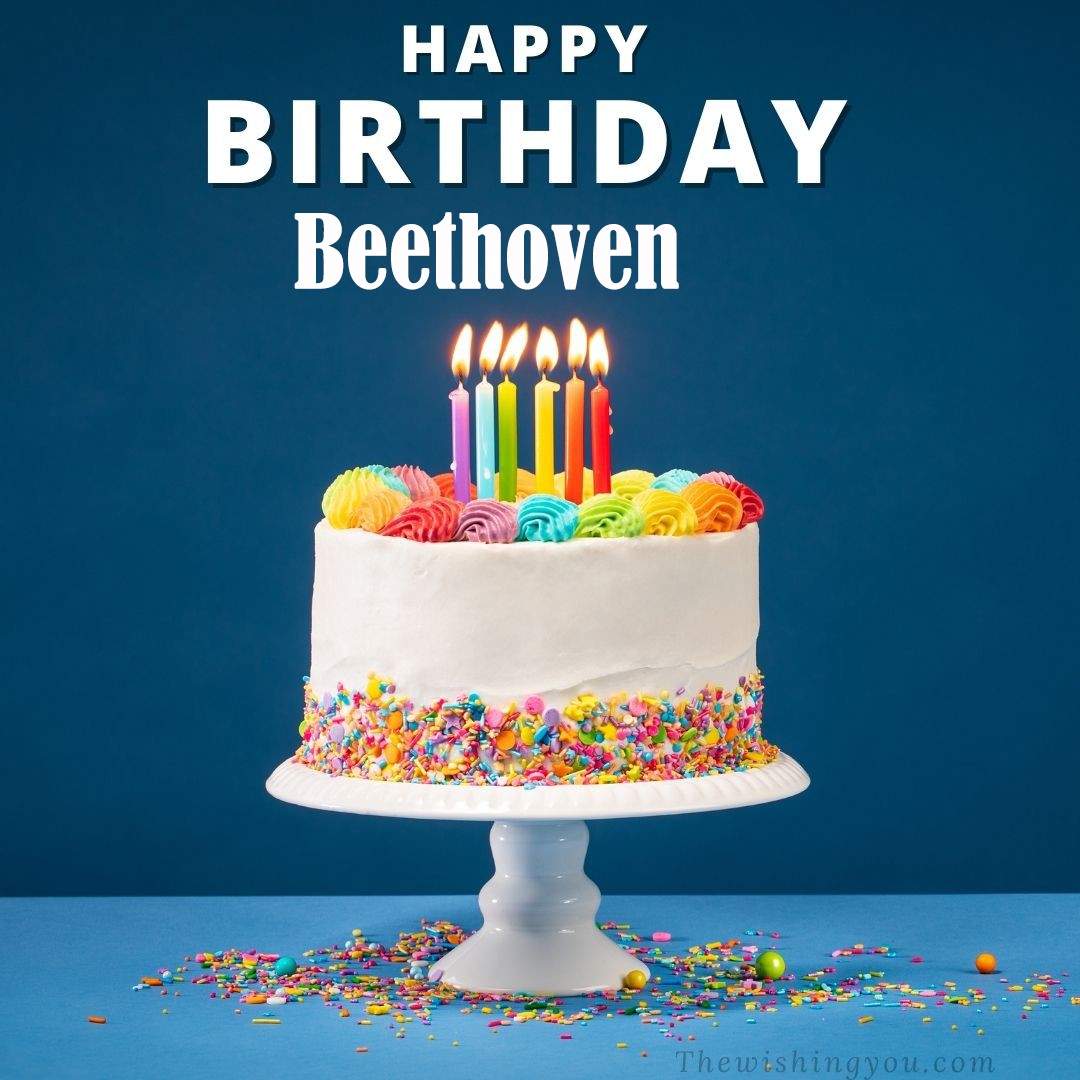 Happy birthday Beethoven written on image White cake keep on White stand and burning candles Sky background