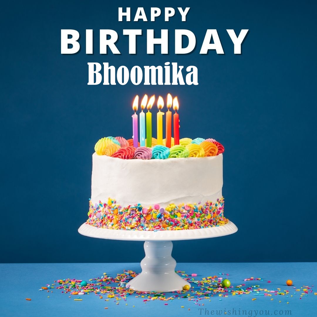 Happy birthday Bhoomika written on image White cake keep on White stand and burning candles Sky background