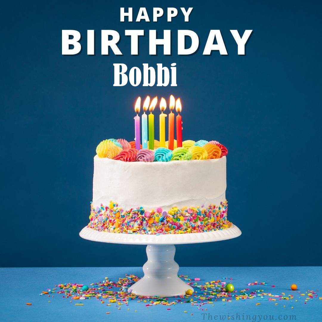 Happy birthday Bobbi written on image White cake keep on White stand and burning candles Sky background