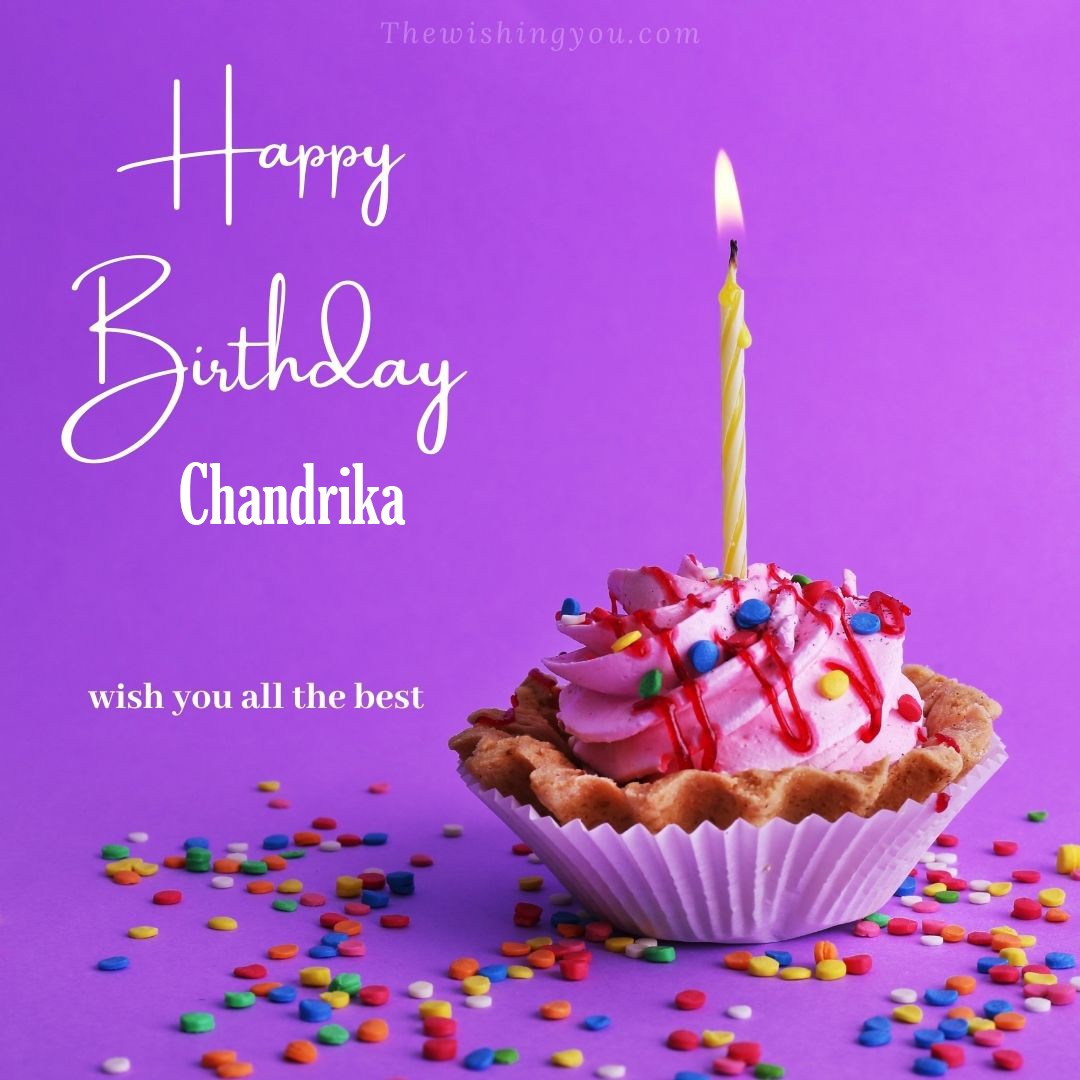Happy birthday Chandrika written on image cup cake burning candle Purple background