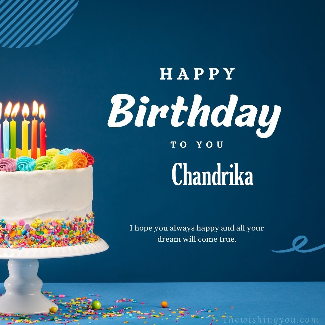 Happy birthday Chandrika written on image white cake and burning candle Blue Background
