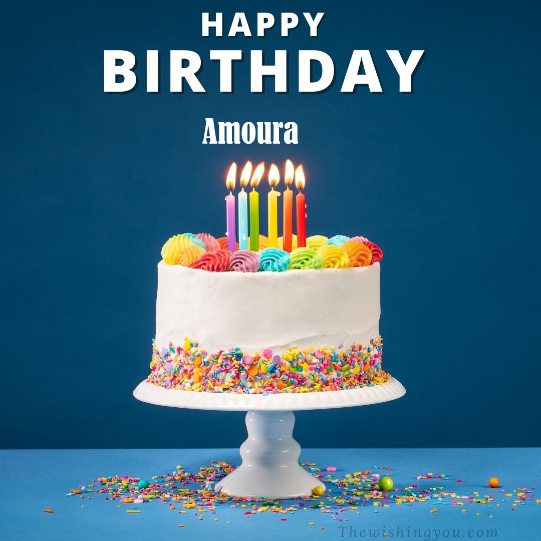 Happy Birthday Amoura written on image White cake keep on White stand and burning candles Sky background