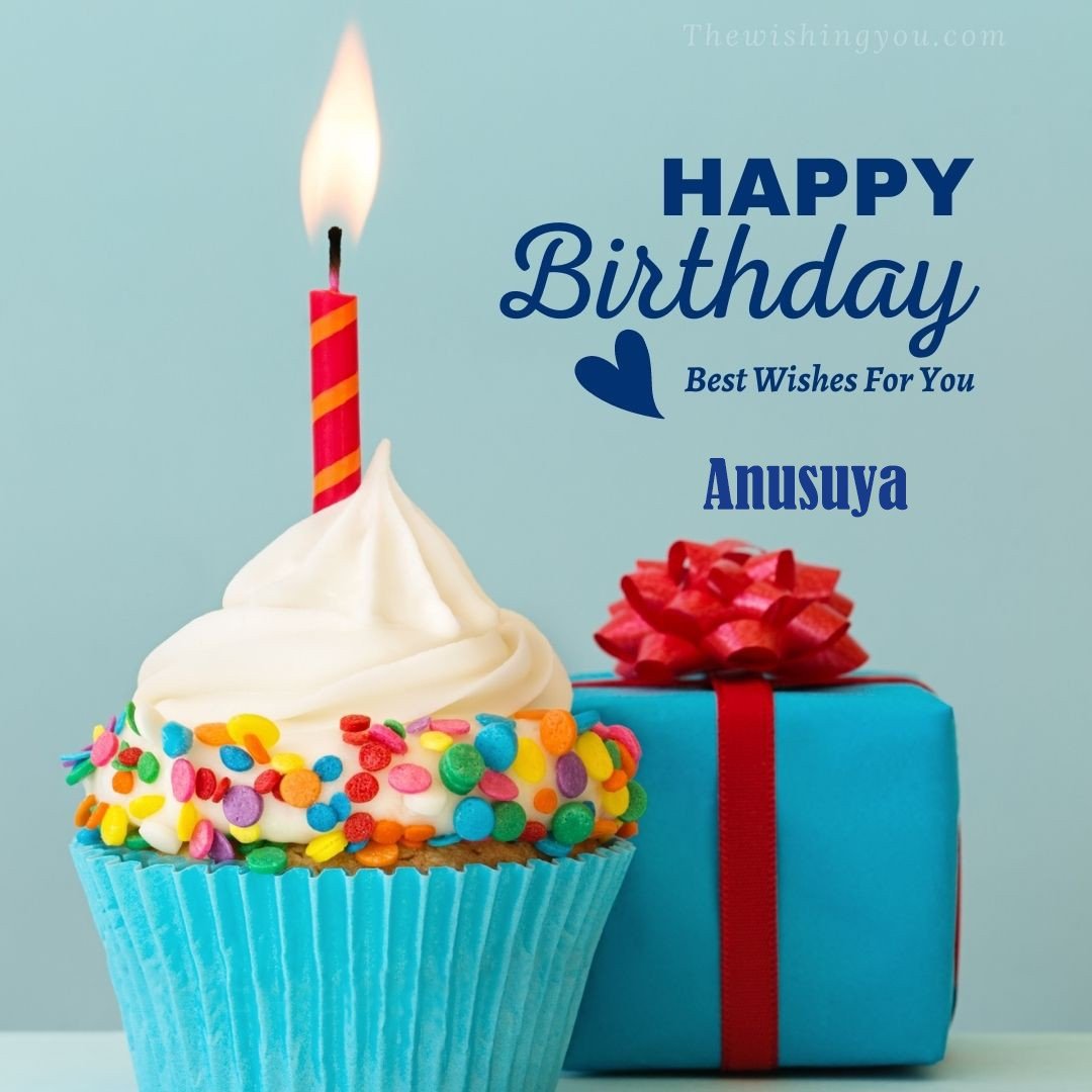 Happy Birthday Anusuya written on image Blue Cup cake and burning candle blue Gift boxes with red ribon