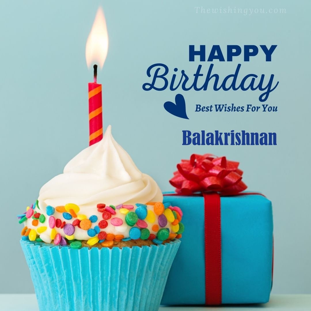 Happy Birthday Balakrishnan written on image Blue Cup cake and burning candle blue Gift boxes with red ribon