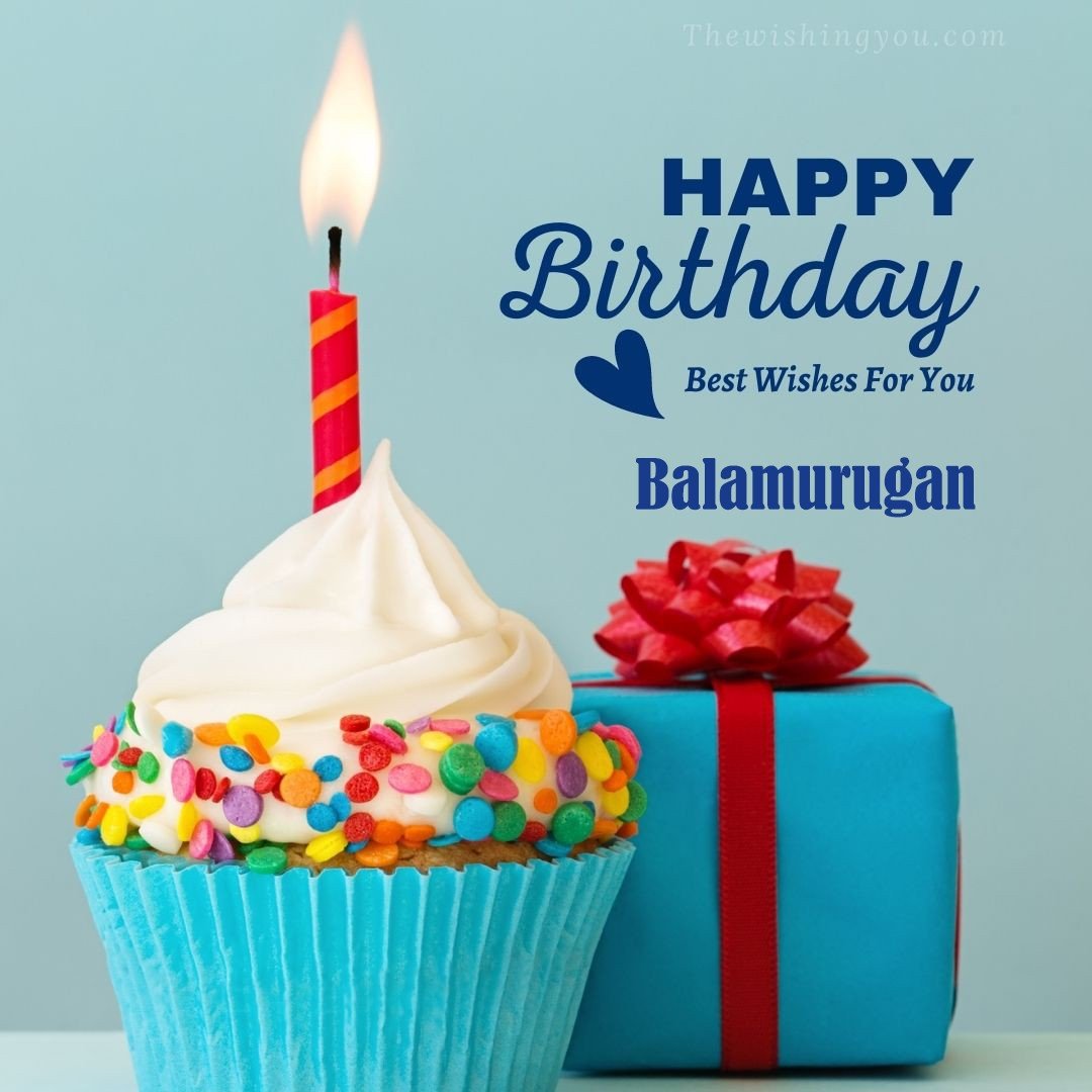 Happy Birthday Balamurugan written on image Blue Cup cake and burning candle blue Gift boxes with red ribon