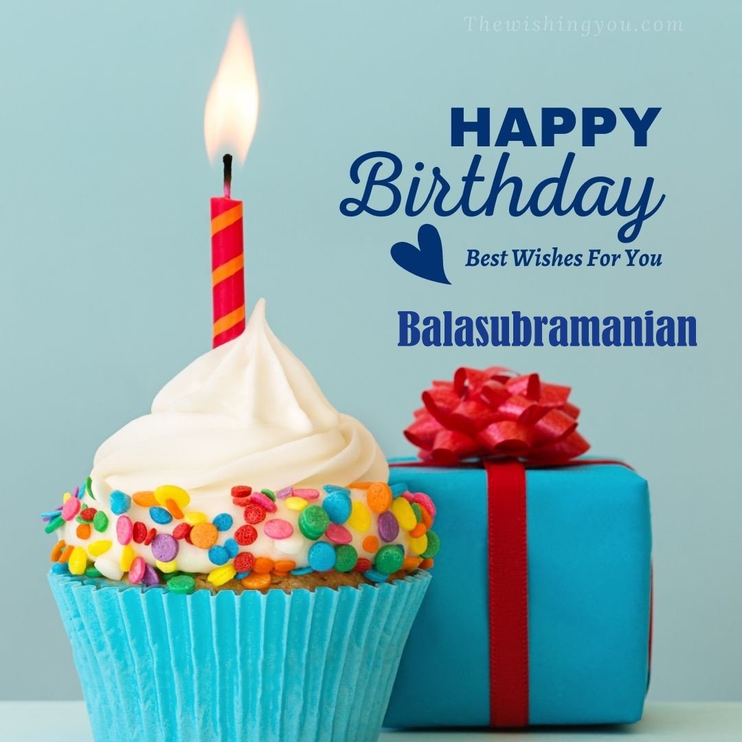 Happy Birthday Balasubramanian written on image Blue Cup cake and burning candle blue Gift boxes with red ribon