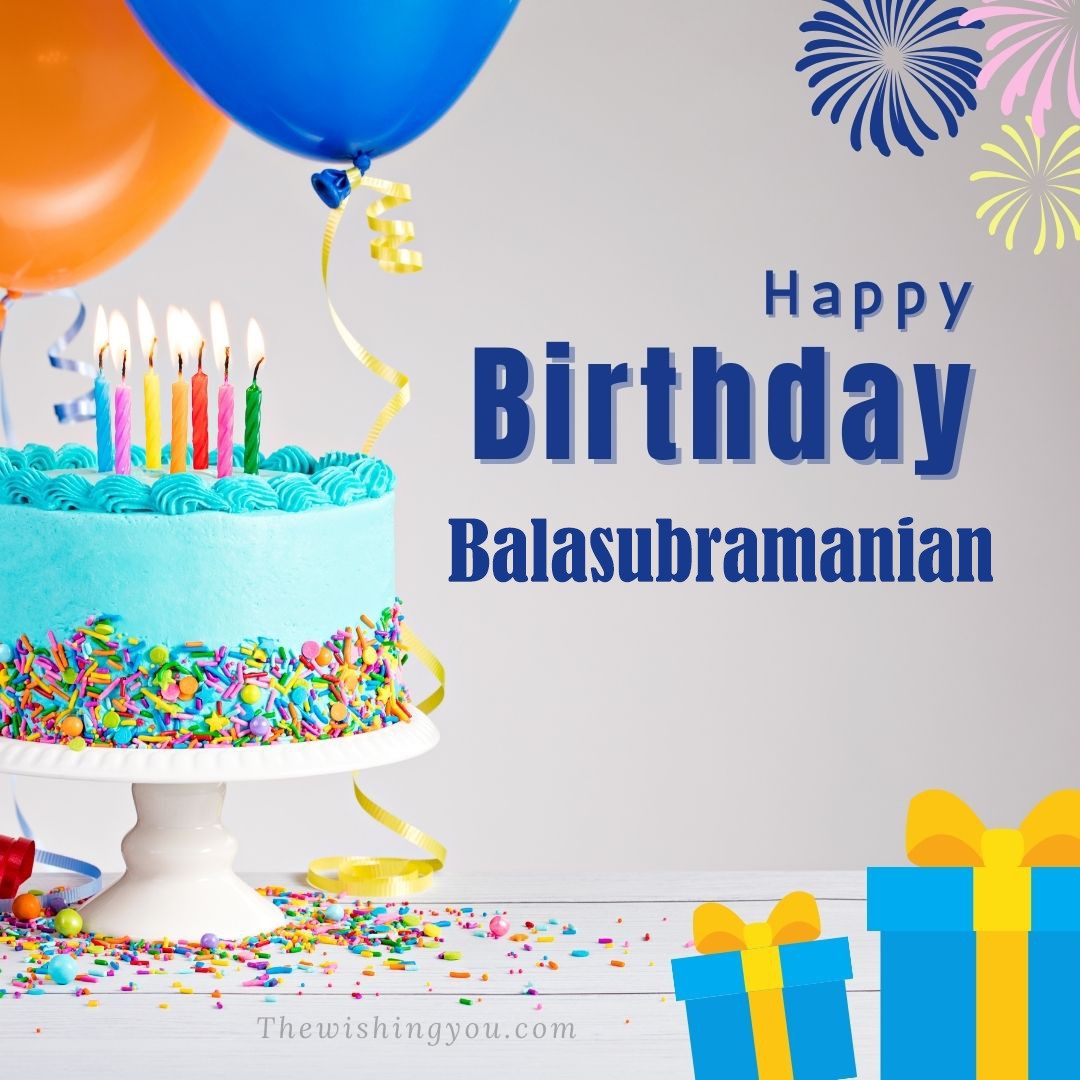 Happy Birthday Balasubramanian written on image Green cake keep on White stand and blue gift boxes with Yellow ribon with Sky background