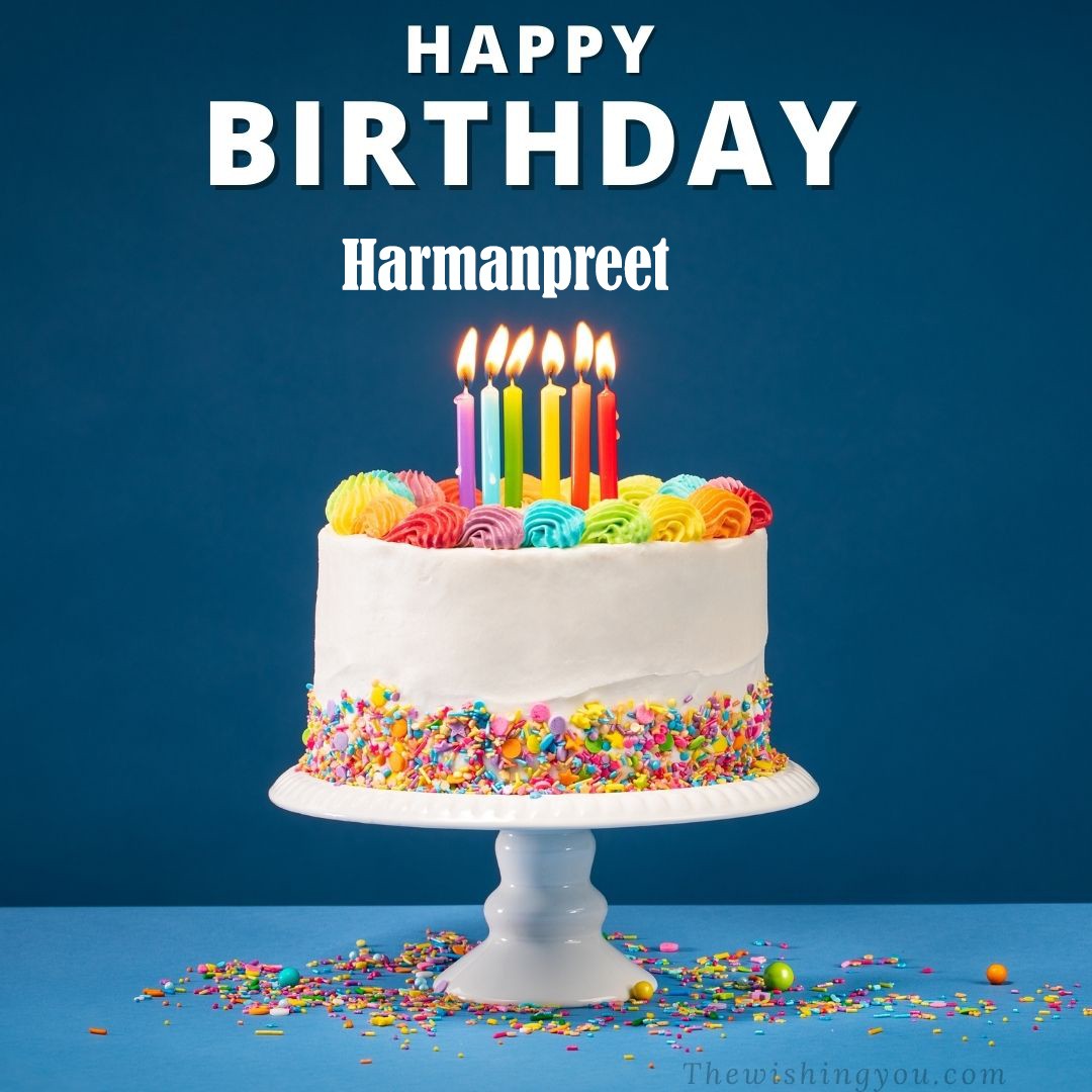 Happy Birthday Harmanpreet written on image White cake keep on White stand and burning candles Sky background