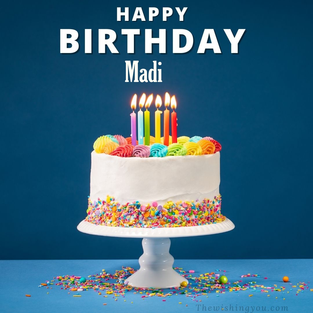 Happy birthday Madi written on image White cake keep on White stand and burning candles Sky background