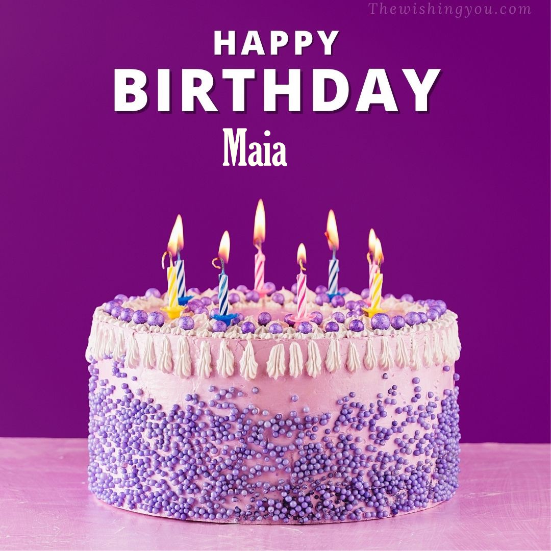 Happy birthday Maia written on image White and blue cake and burning candles Violet background