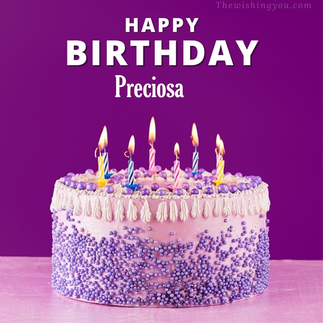 Happy birthday Preciosa written on image White and blue cake and burning candles Violet background