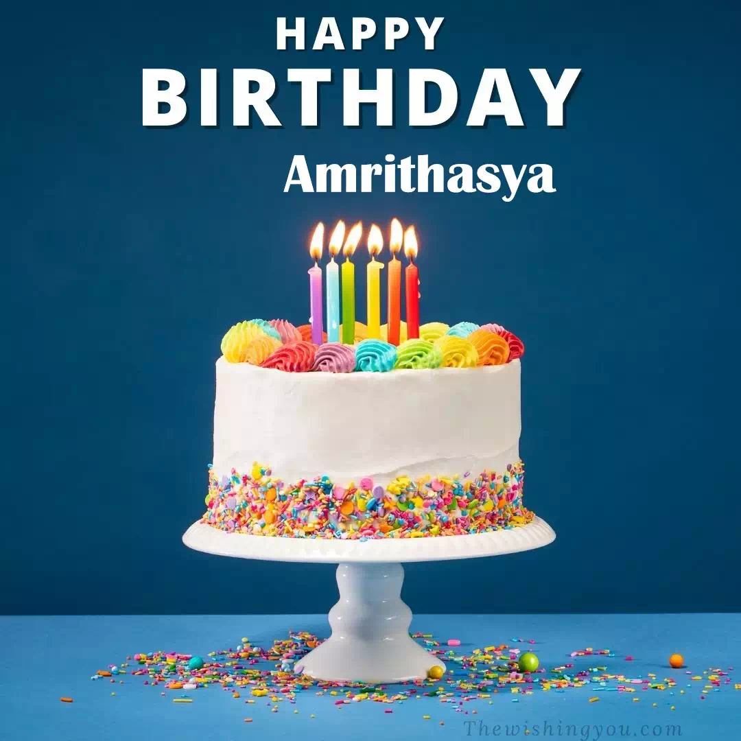 Happy Birthday Amrithasya written on image, White cake keep on White stand and burning candles Sky background
