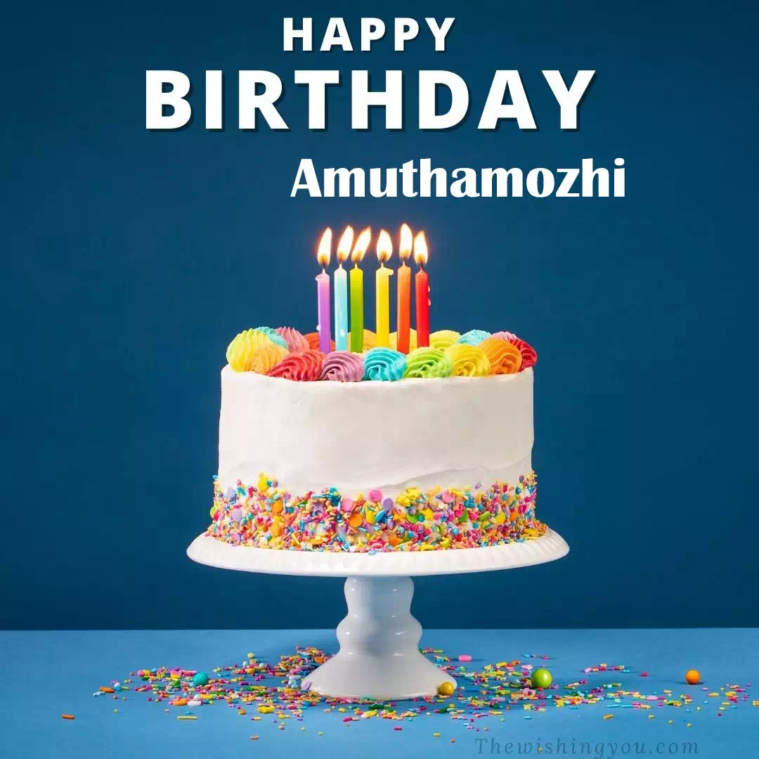 Happy Birthday Amuthamozhi written on image, White cake keep on White stand and burning candles Sky background