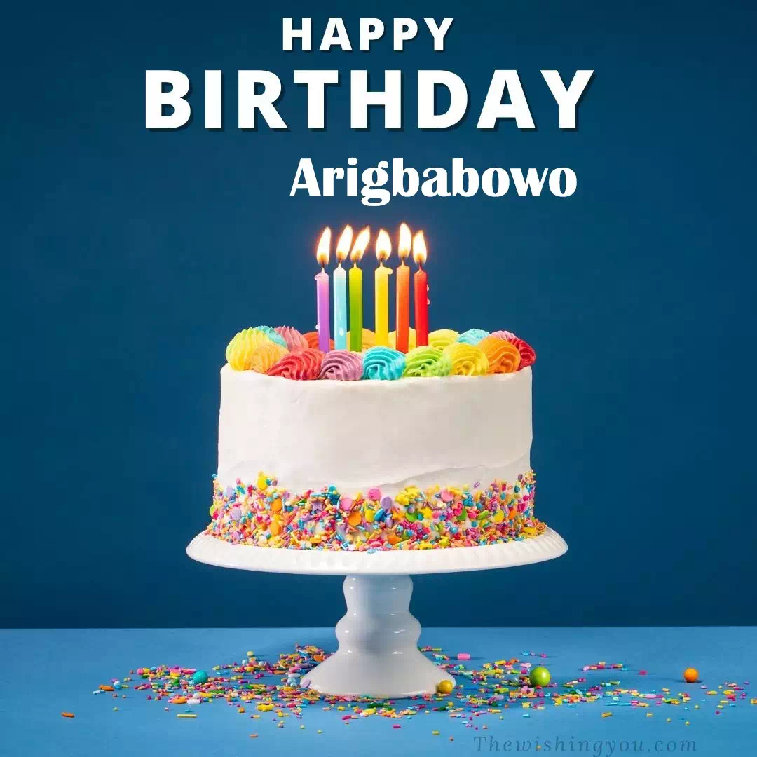 Happy Birthday Arigbabowo written on image, White cake keep on White stand and burning candles Sky background