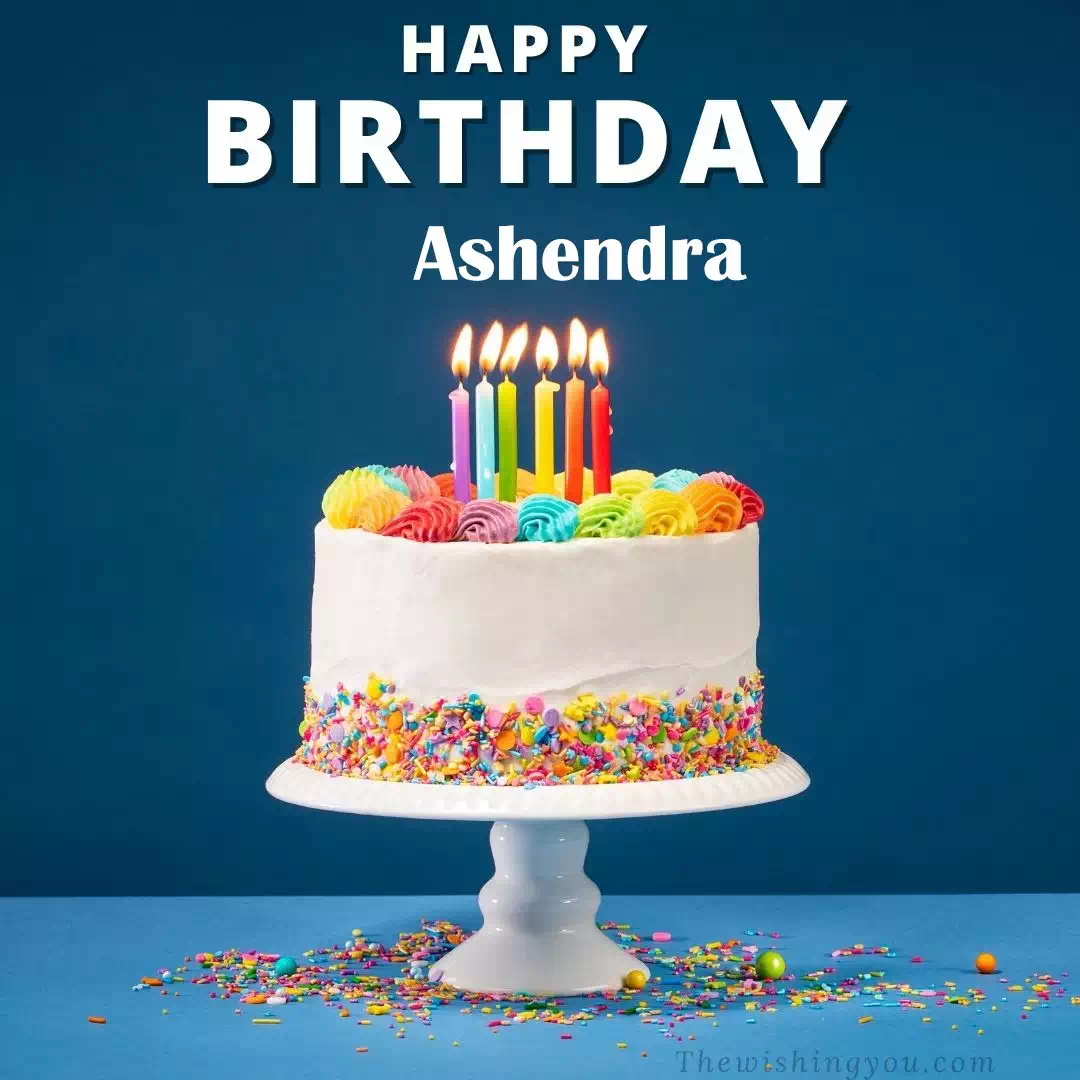 Happy Birthday Ashendra written on image, White cake keep on White stand and burning candles Sky background
