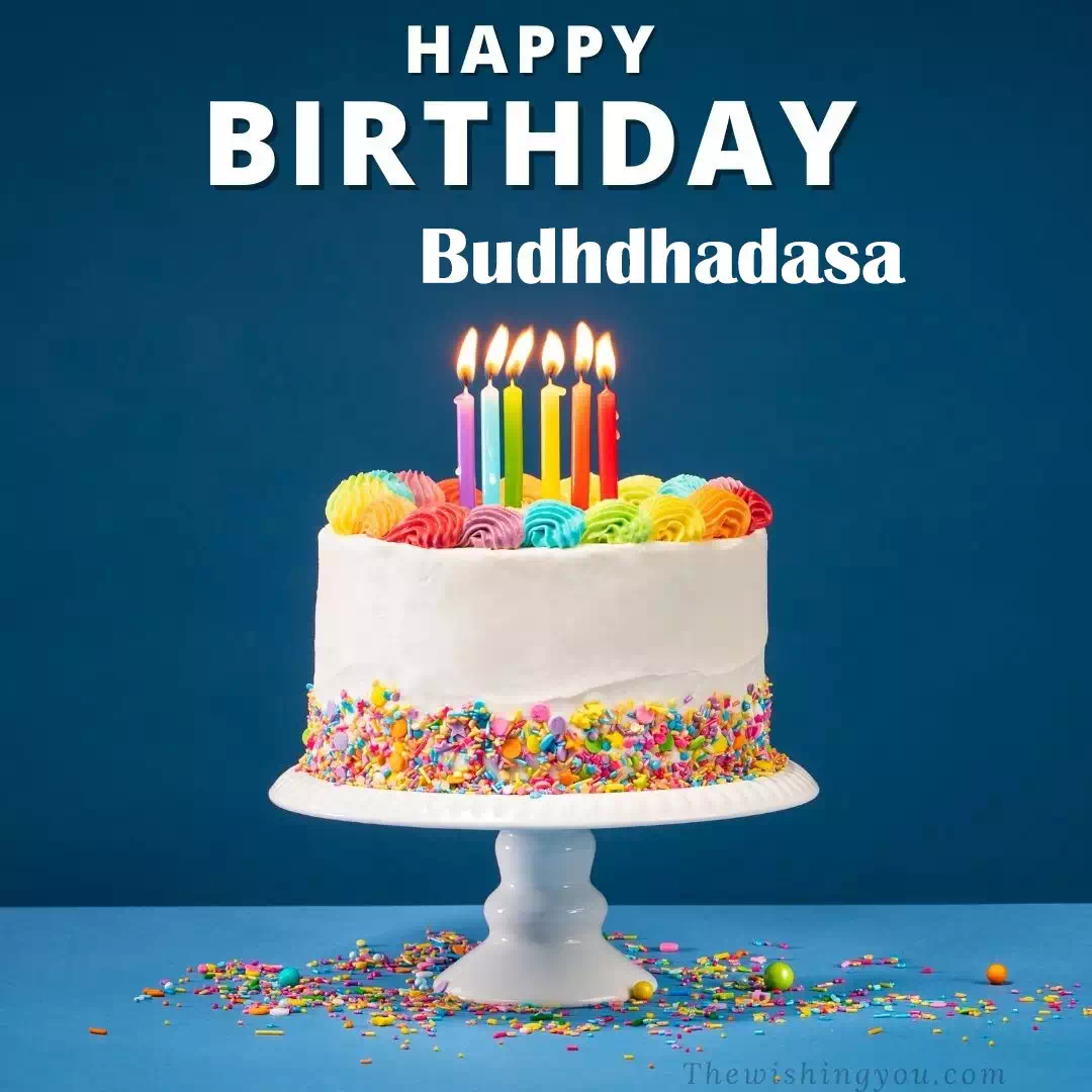 Happy Birthday Budhdhadasa written on image, White cake keep on White stand and burning candles Sky background
