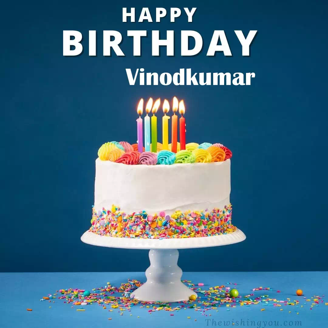 Happy Birthday Vinodkumar written on image, White cake keep on White stand and burning candles Sky background